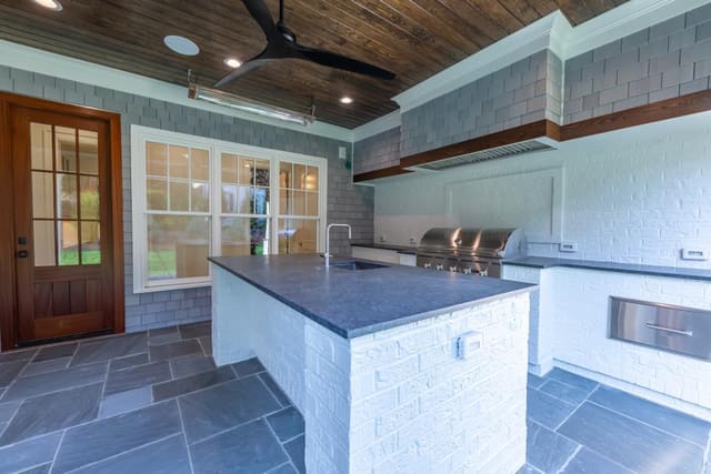Outdoor Kitchen Area with white brick.
