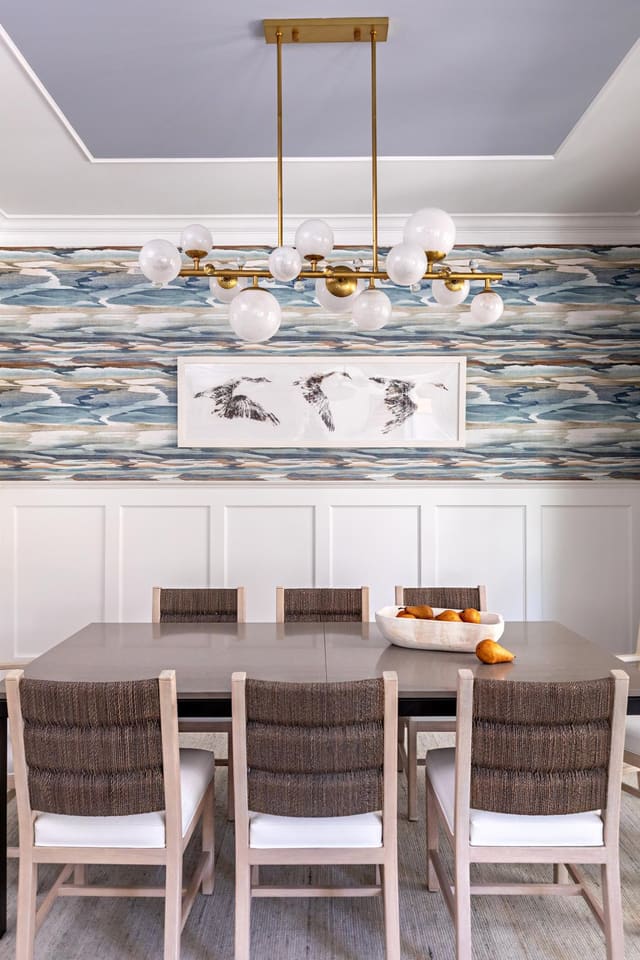 Dining area with brass light fixture