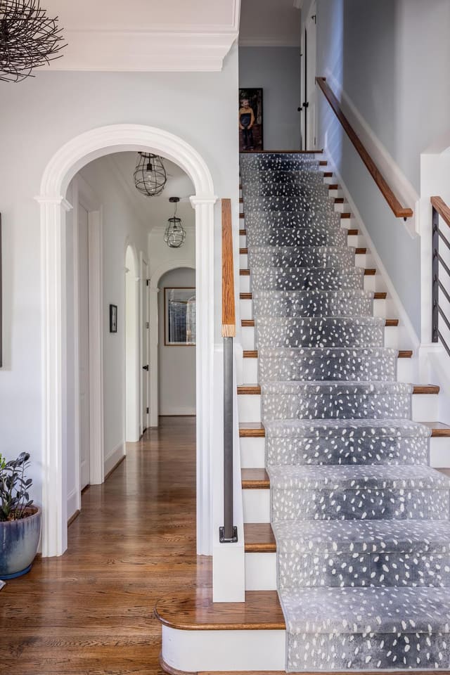 Staircase and arched hallway