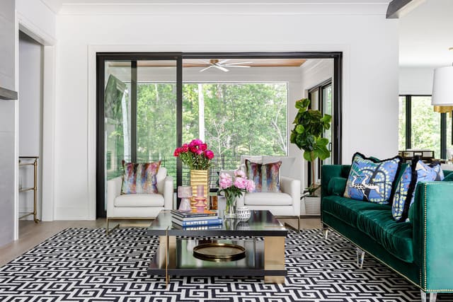 Living room that leads onto the screened in outdoor living space.