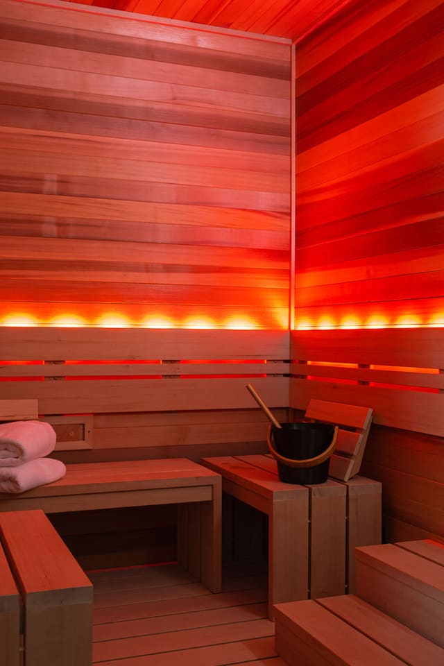 Red backlit in-house sauna.