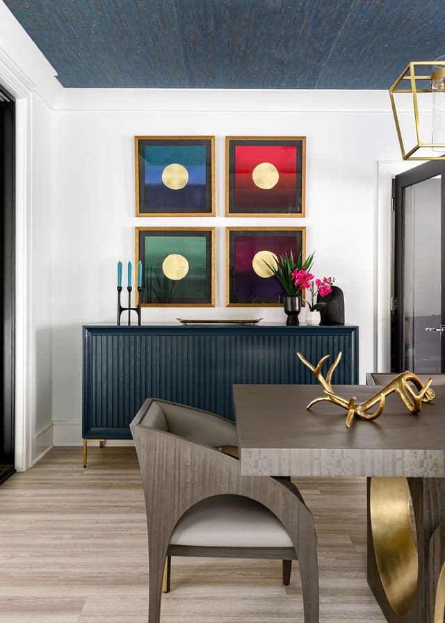 Set of four matching framed pieces of art.