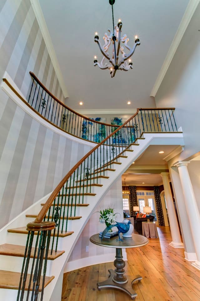 Dramatic Foyer with striped grasscloth wallpaper