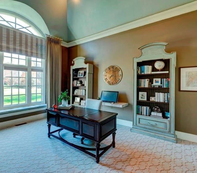 Home Office with twin bookcases and custom window treatments