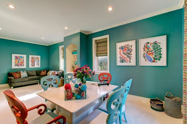 Play Room or Craft Room with turquoise walls and bright artwork