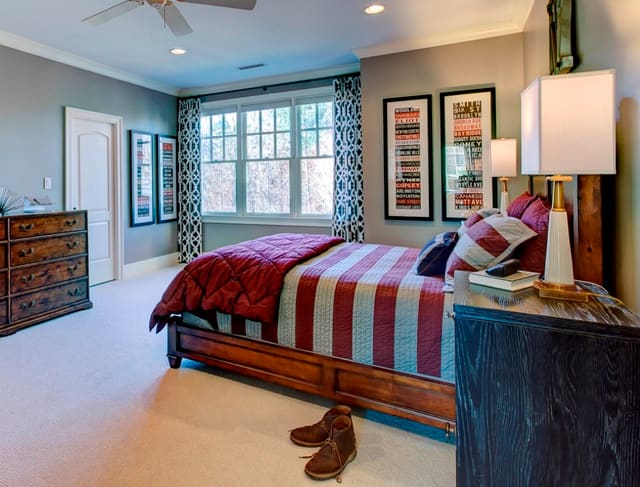 Boy's Bedroom with masculine furniture custom drapery panels and semi custom bedding