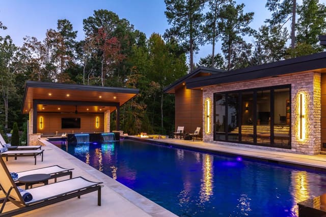 Exterior Pool Overlooking Bar and Poolhouse