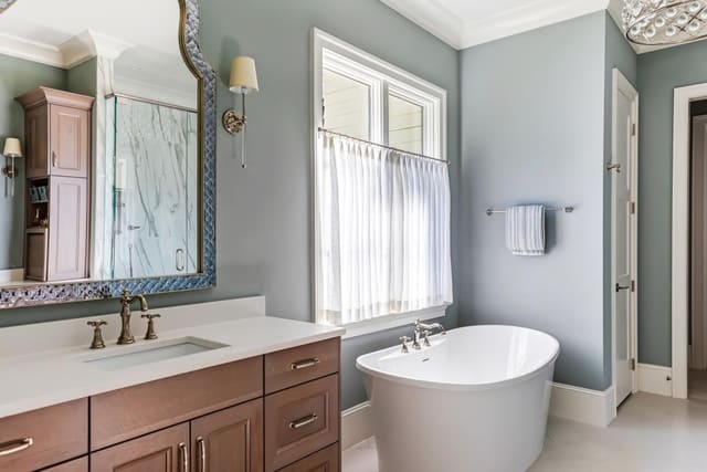 N. Raleigh Master Bathroom with soaker tub and cafe curtain