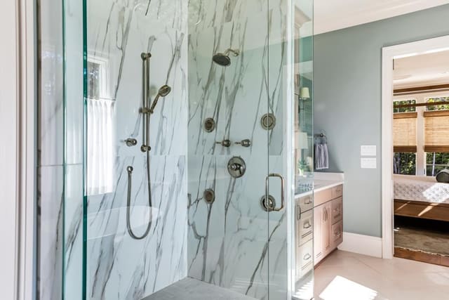 Master Bath with marble tiled shower