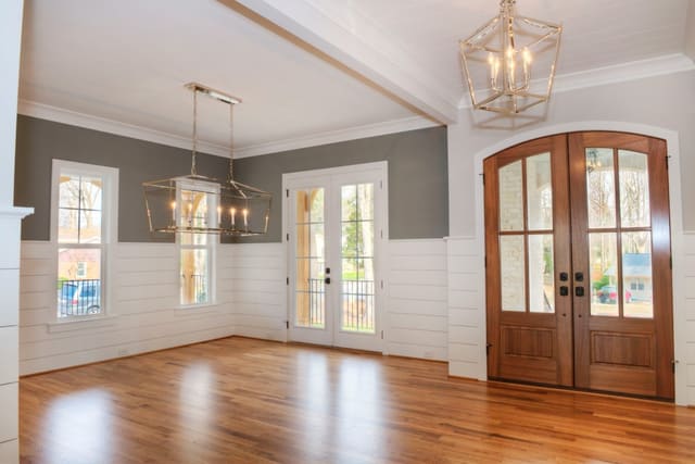 Foyer and Dining Room of North Raleigh home with chrome light fixtures