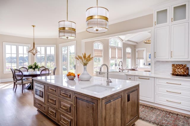 Bright kitchen with natural wood accents that opens up to a beautiful view of the backyard.