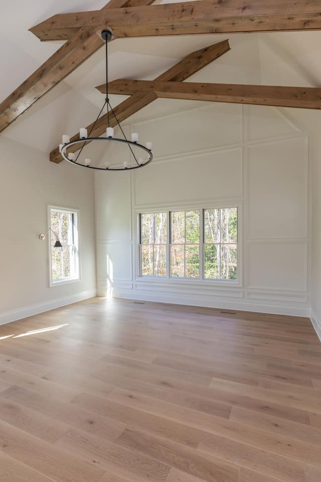 Master with Vaulted Ceiling and Wooden Beam Accents