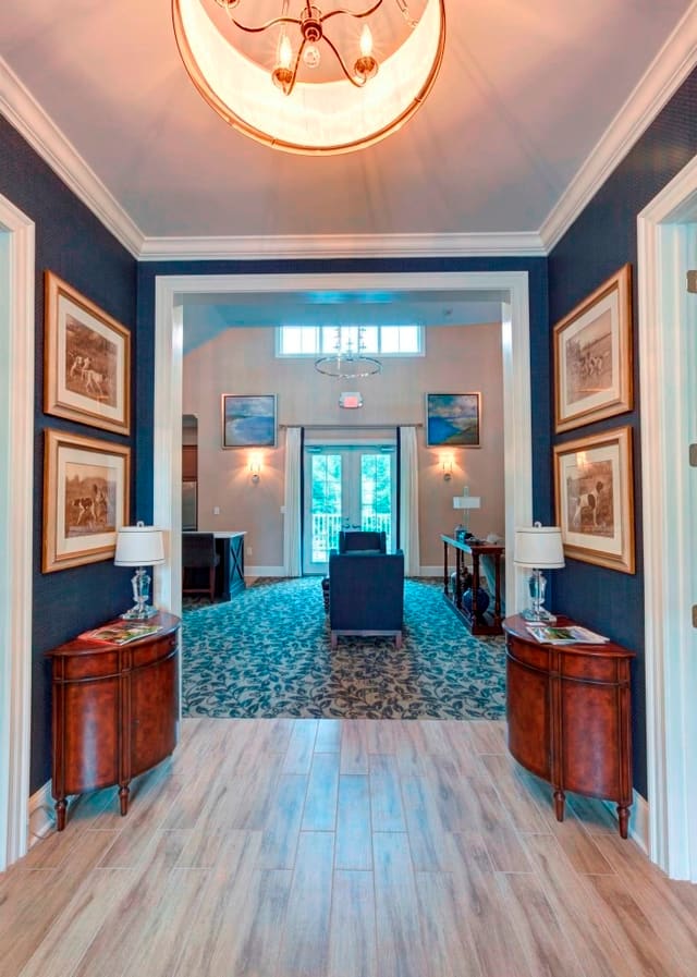Foyer looking into Gathering Room at Hamptons' Clubhouse - blue grasscloth wallpaper