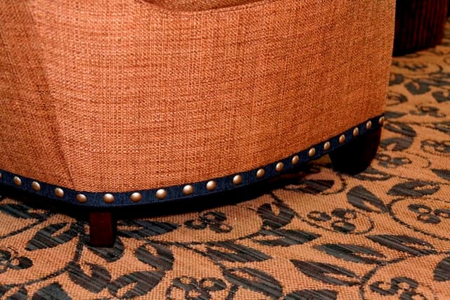 Contrast fabric banding under nailheads on sofa