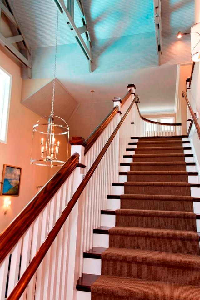 Staircase in Raleigh clubhouse with carpet runner