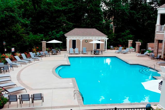 Pool deck at Raleigh Clubhouse with outdoor furniture