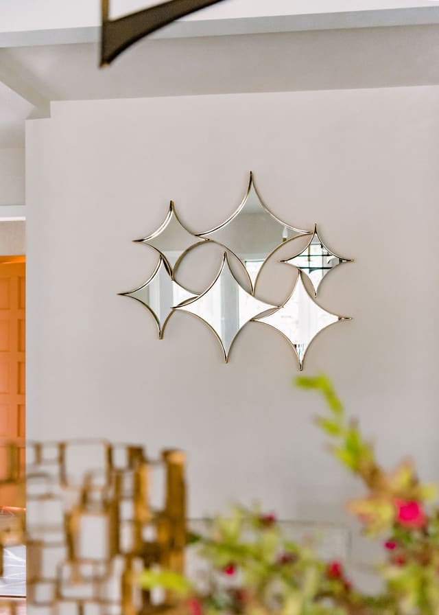 Diamond shaped mirrors set on Dining Room wall.
