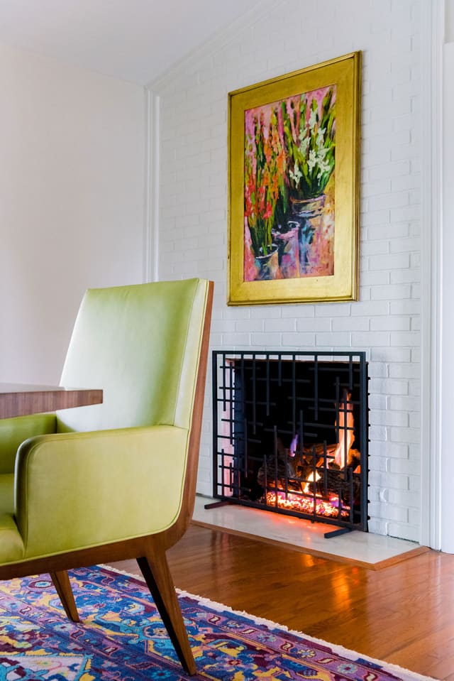 Mid-Century Modern Dining Room featuring painted white fireplace.