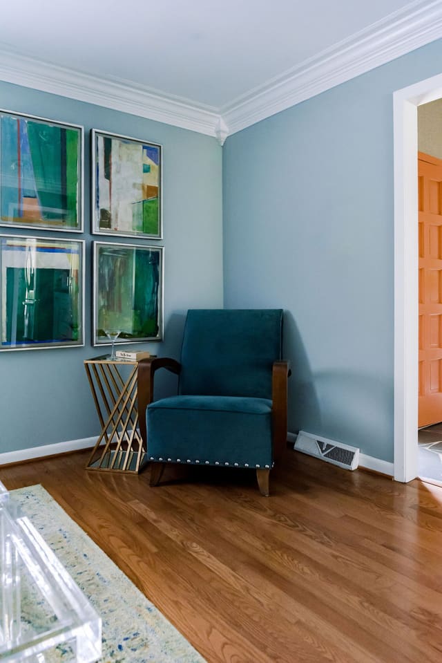 Corner of Sitting Room showing Teal chair and abstract art series.