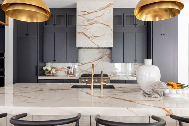 Close up Kitchen with Marble countertops and black cabinetry