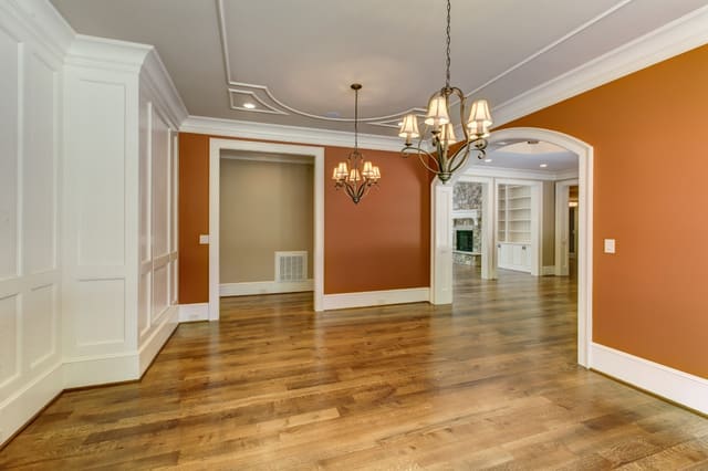 Dining Room in Raleigh Home with decorative ceiling and twin chandeliers