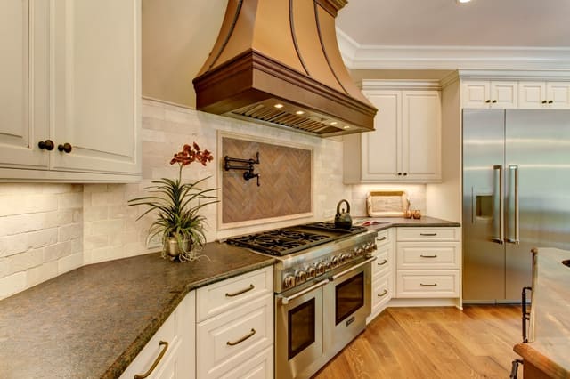 Raleigh Kitchen with custom range hood, tile backsplash and pot-filler