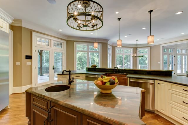 Raleigh Kitchen with large island with pendant lights overhead and smaller island with chandelier overhead