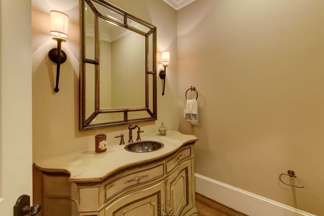 Powder Room in Raleigh home with decorative vanity