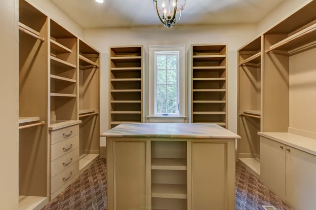 Master closet in Raleigh home with center island