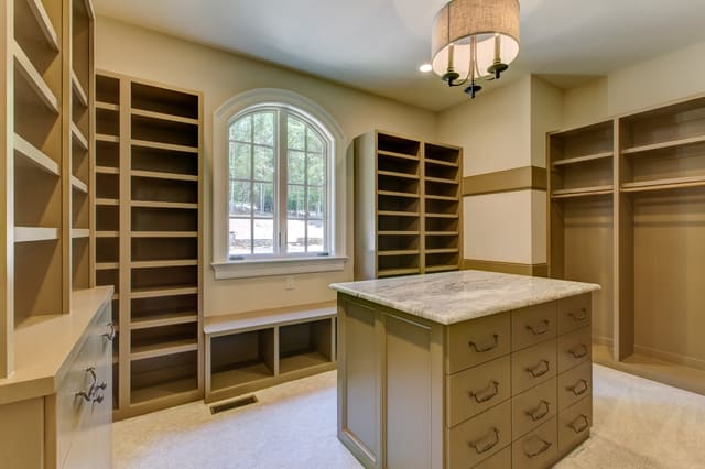 Master closet in Raleigh home with center island