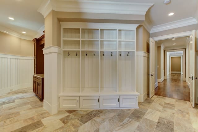 Built-in bookshelf with coat hooks and cubbies