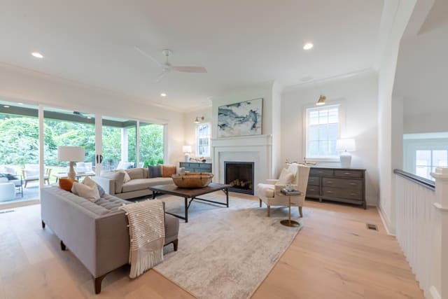 Open concept living room with grey and white accents