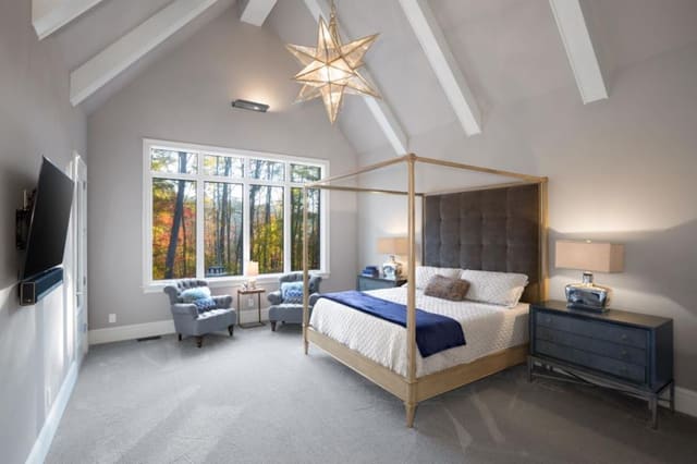 Wake Forest Master Bedroom with lofted ceiling and exposed beams