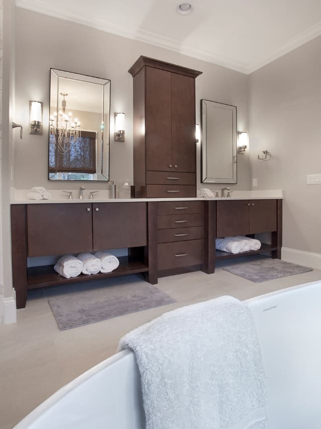 Bathroom in Wake Forest home with dark clean-lined cabinets