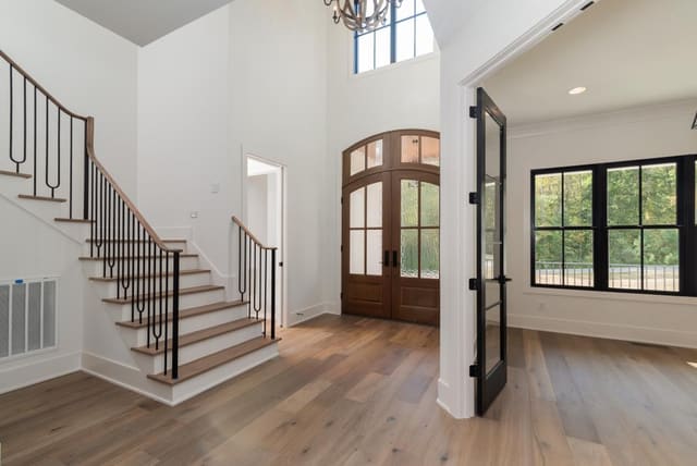 Foyer with Arched Door Frame