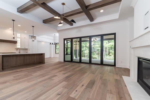 Open Concept Kitchen and Living Area with Exposed Beams