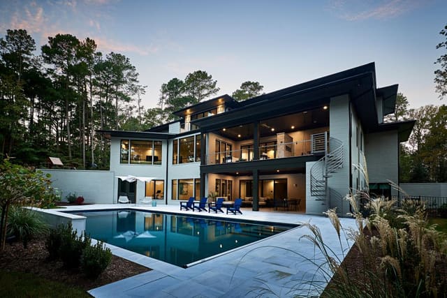 Exterior of modern West Cary home - rear of home with pool