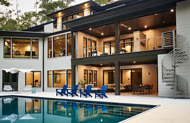 Exterior of modern West Cary home - rear of home with pool