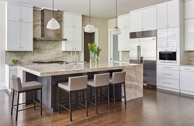 Modern Kitchen with waterfall countertops on island and white lacquered cabinets
