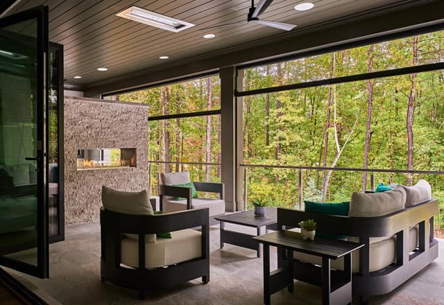 Modern covered porch with modern fireplace