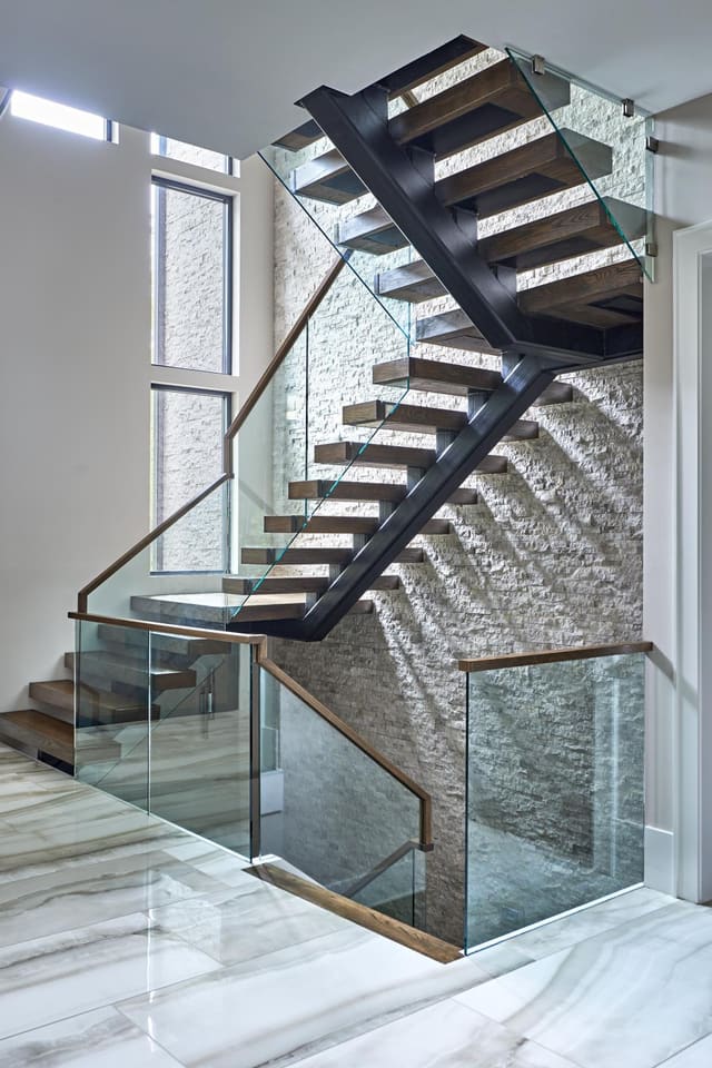 Modern staircase with glass rails