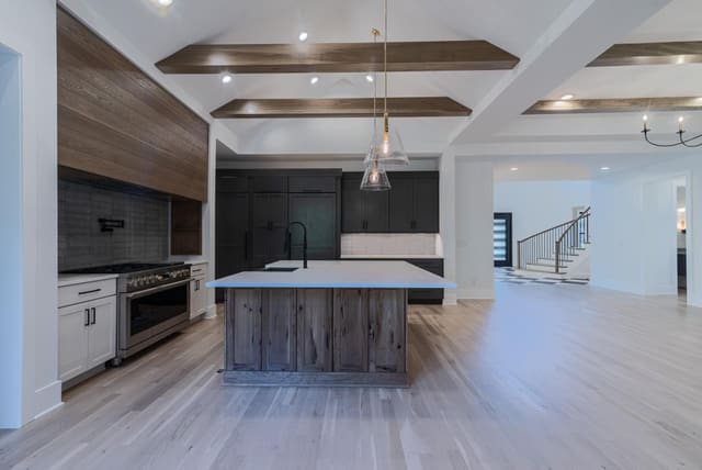 Open Concept Kitchen with Exposed Ceiling Beams
