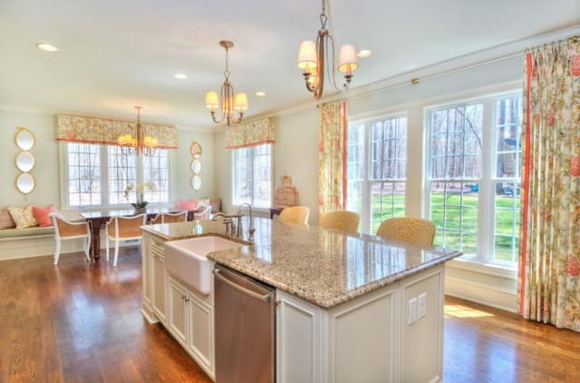West Raleigh Kitchen with custom window treatments, upholstered barstools, twin mirrors, and custom bench cushion with pillows