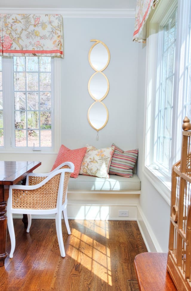 West Raleigh Kitchen with custom window treatments, twin mirrors, and custom bench cushion with pillows