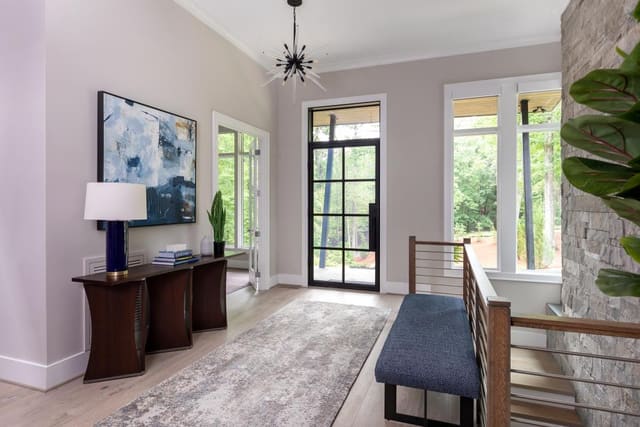 Foyer with Blue abstract artwork and modern light fixture