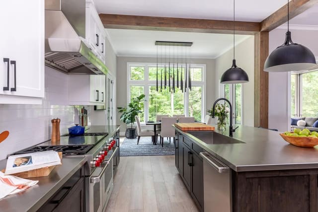 Open Layout Kitchen with Stainless Steel Countertops