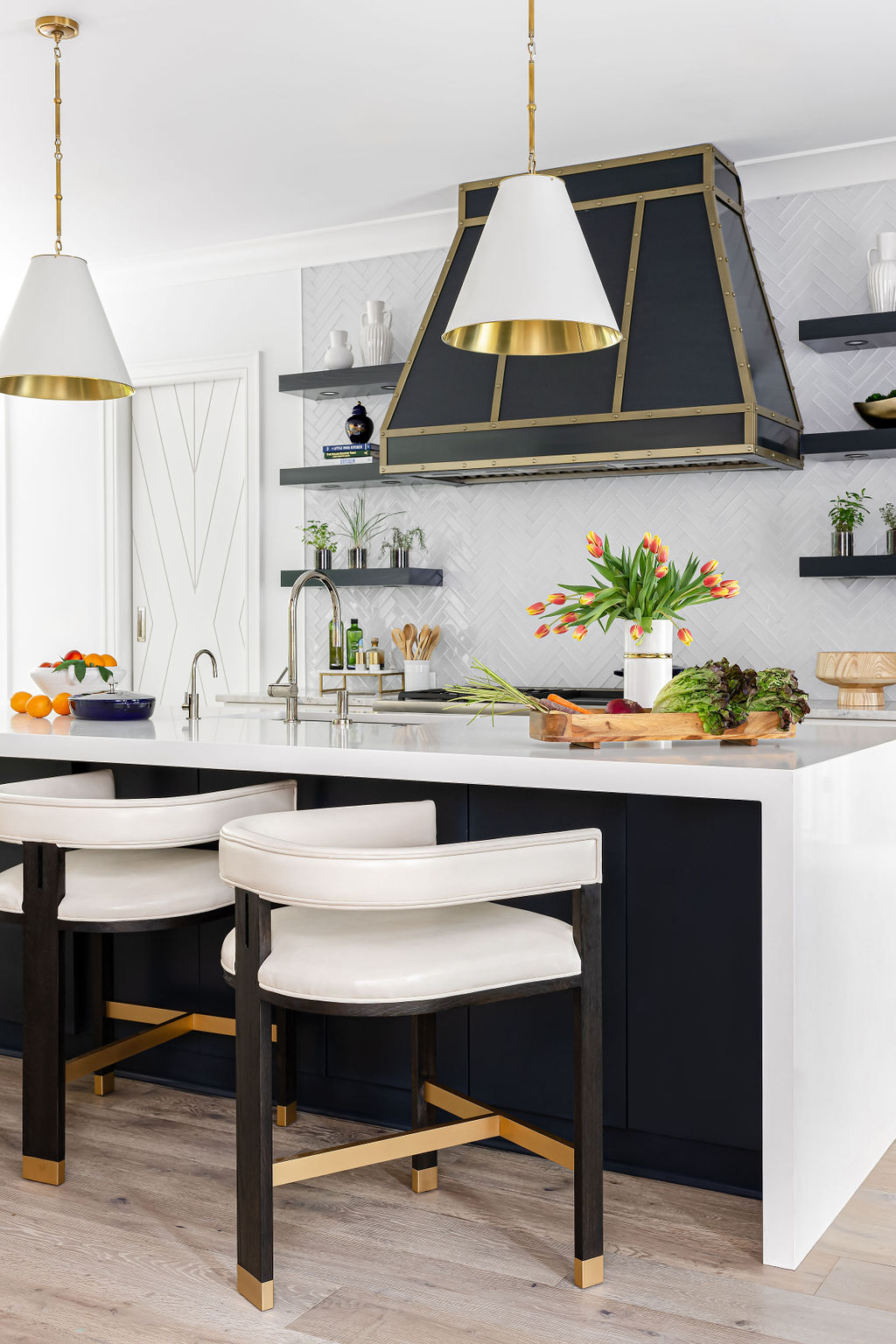 Custom kitchen island with pendant lighting and seating